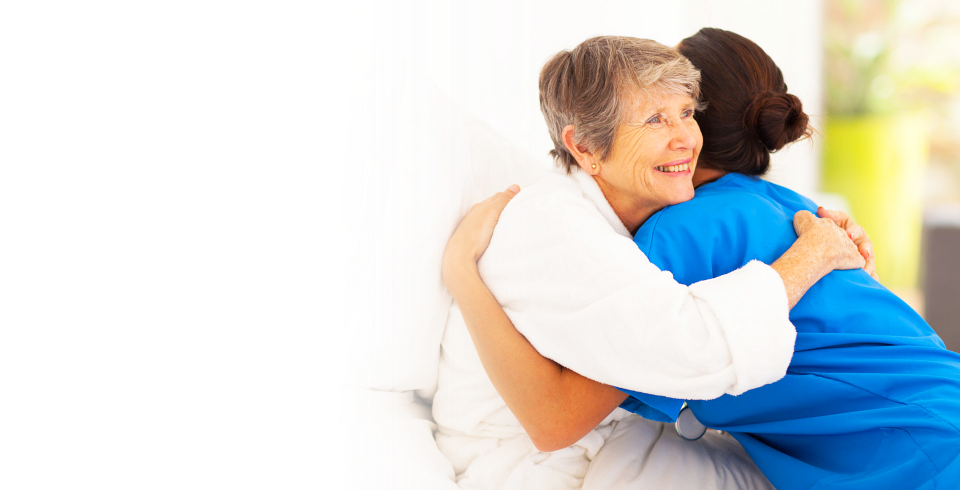 Patient hugging her caregiver